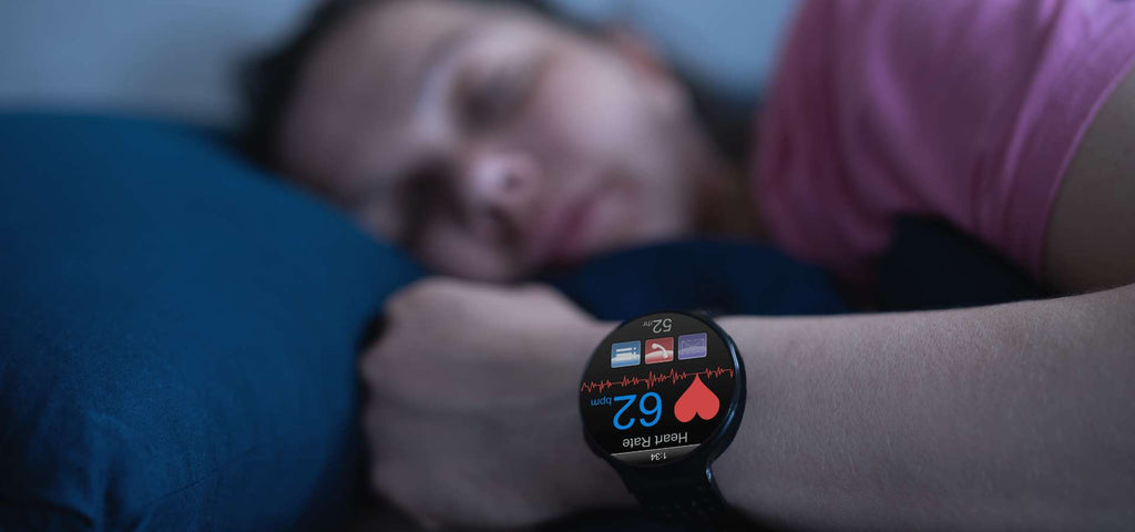 Woman sleeping while wearing a health tracker