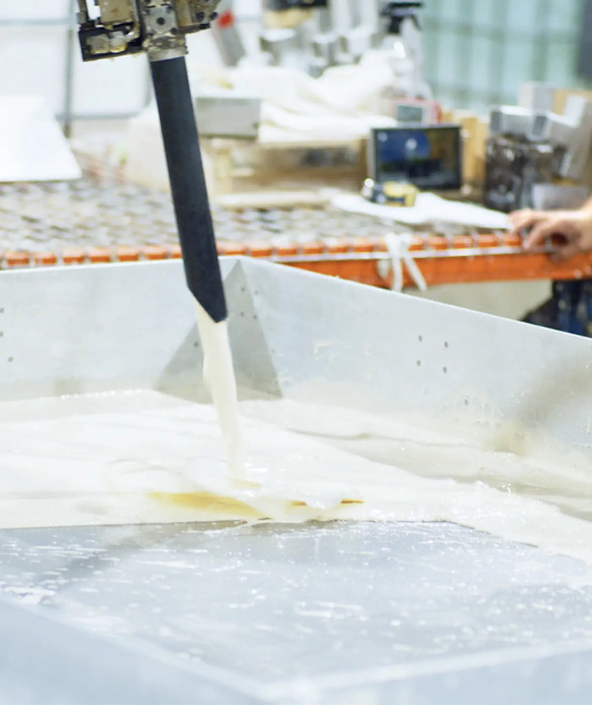 An Essentia foam machine hard at work pouring organic and vegan foam into a mold.