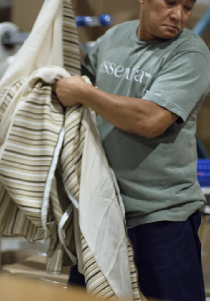 A man carrying an Essentia mattress cover