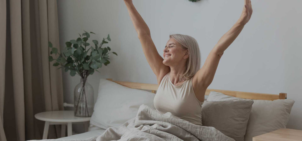 Woman waking up refreshed and ready to accomplish her 2025 goals