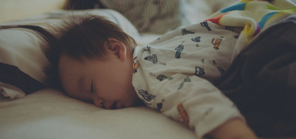 Baby fast asleep on his stomach