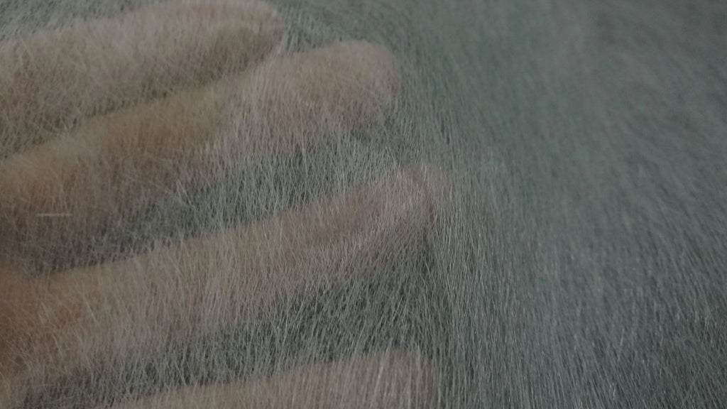 Hand showing fiberglass shards