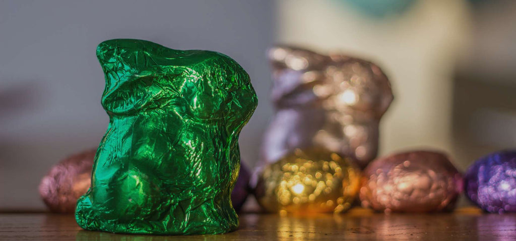 Easter chocolate in the shape of a bunny wrapped in green foil