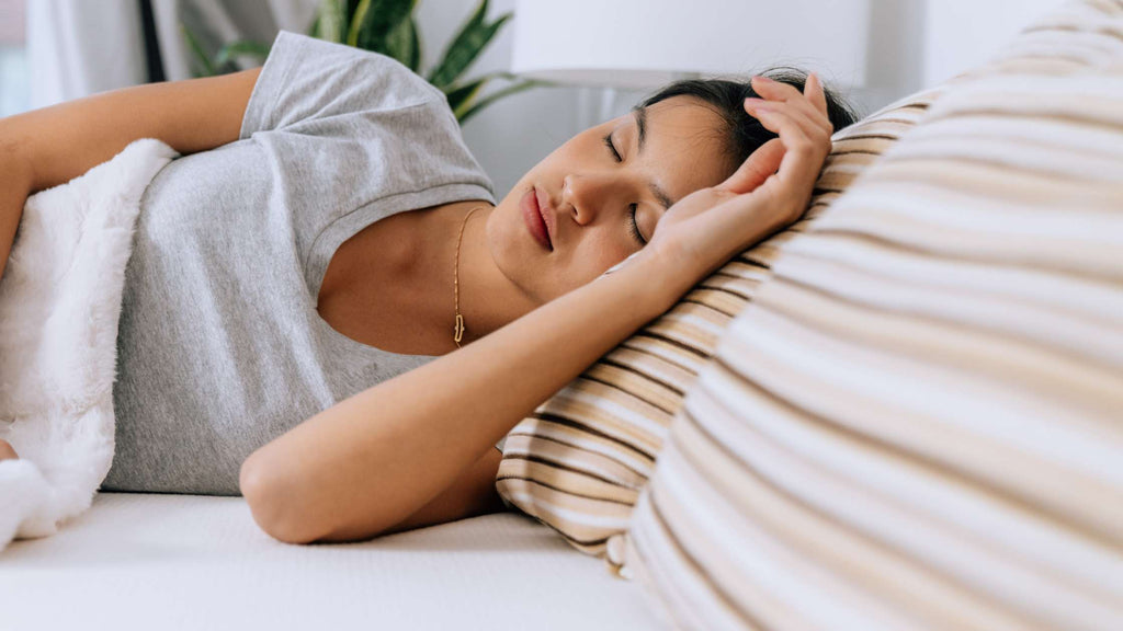 Woman sleeping on Essentia organic latex pillows