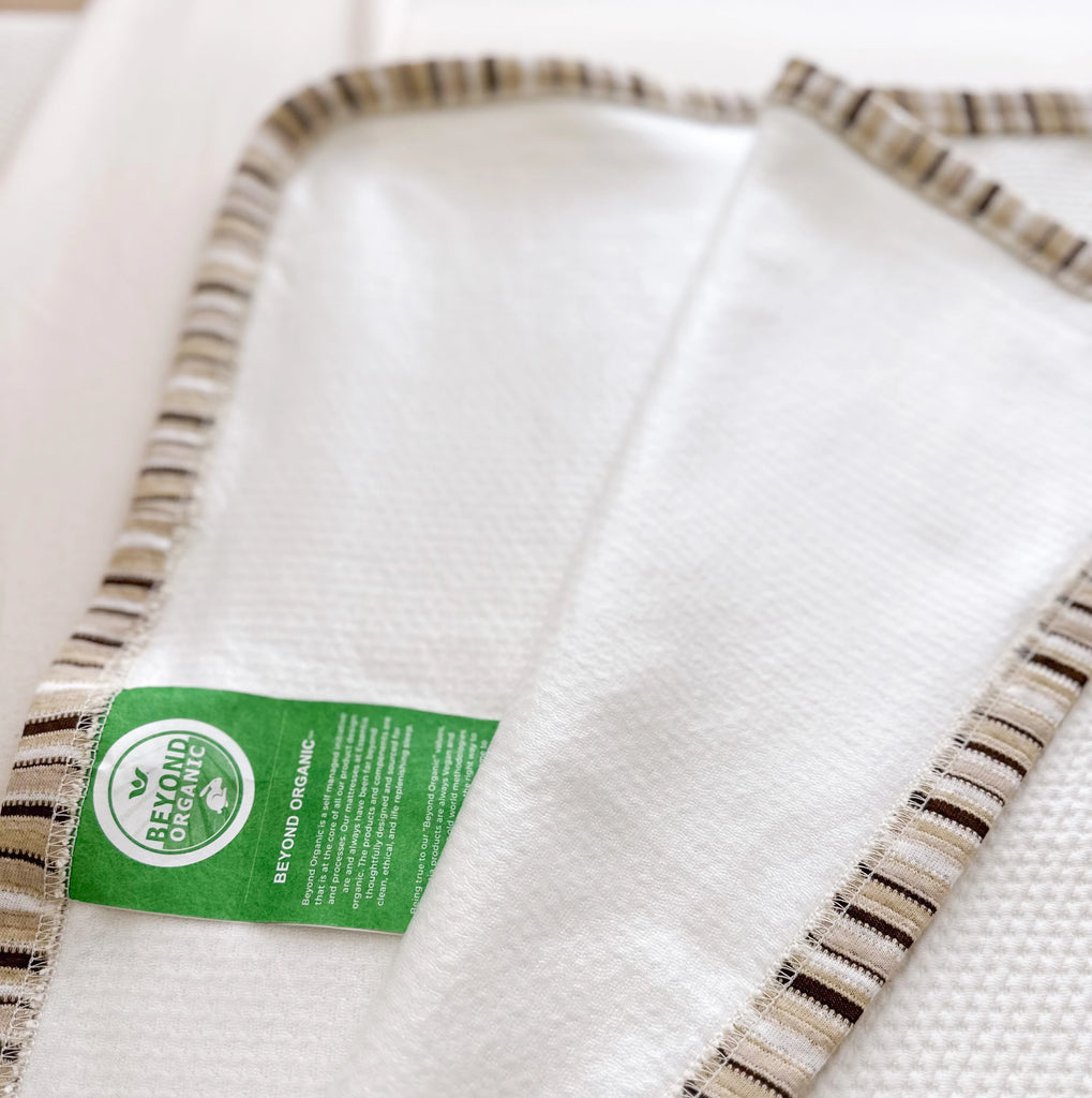 Close up of the food grade waterproof liner of the Essentia Stinky Pad and Essentia Beyond Organic label