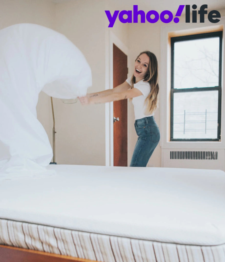 Image showing woman putting sheets on her Essentia organic mattress