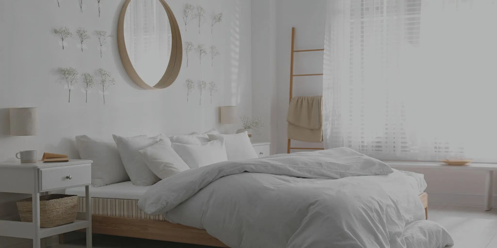 Essentia mattress shown in a clean white room with a gold mirror