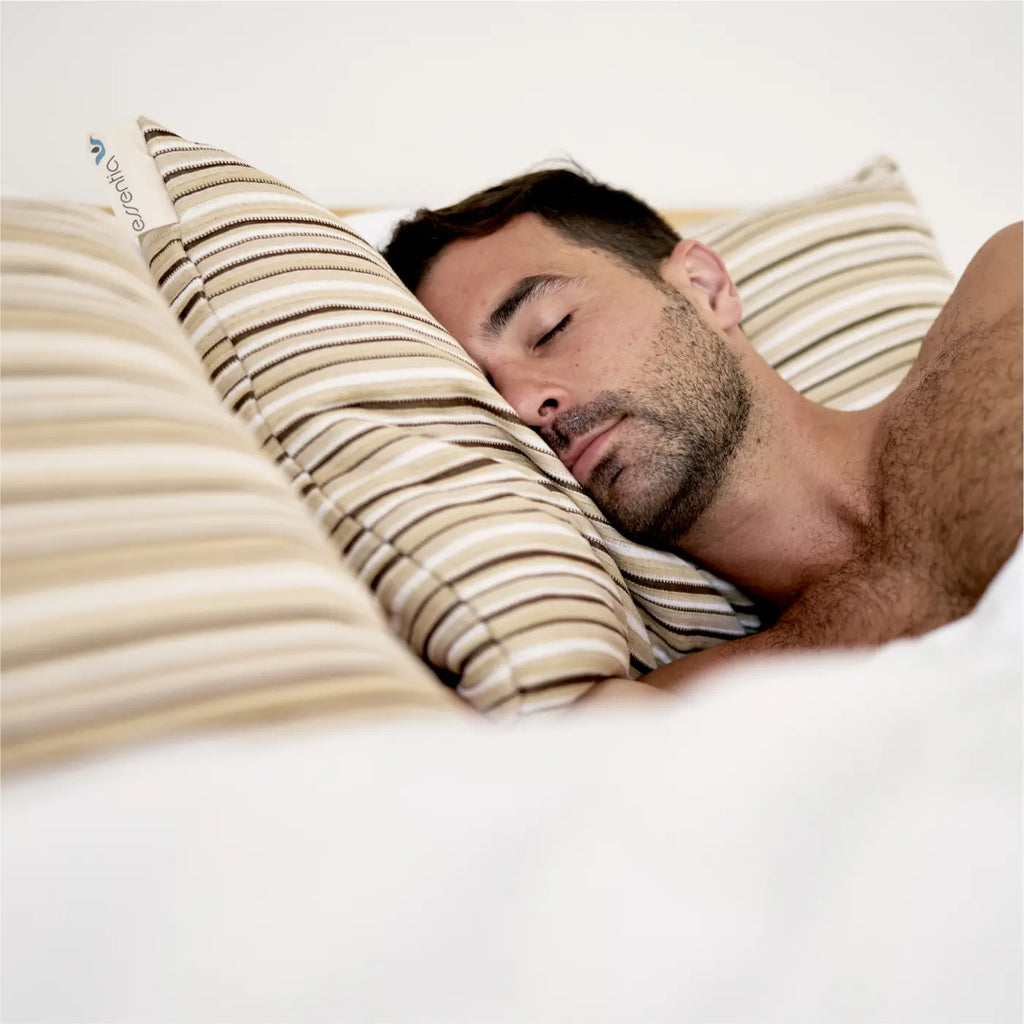 Man in a deep sleep with head resting on a comfy pillow