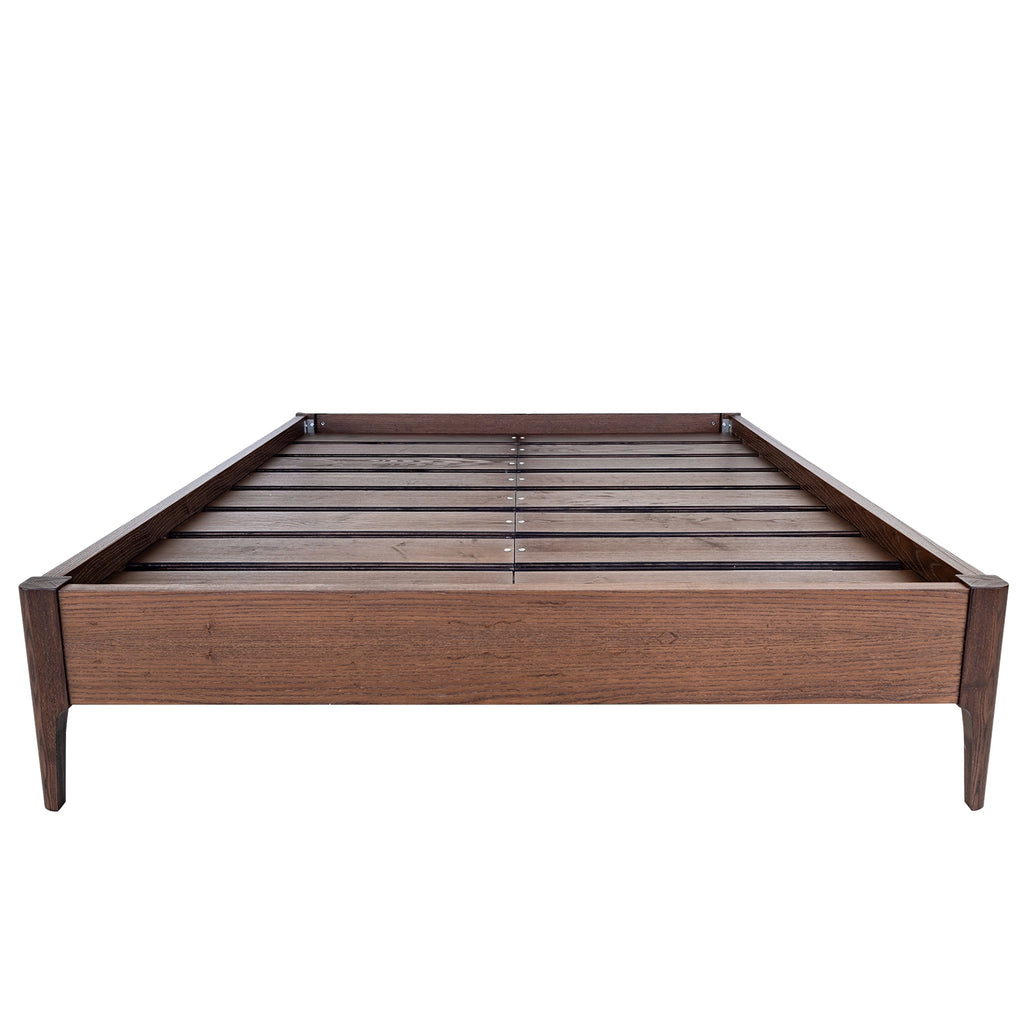 Mesa wood bed frame shown without the headboard.