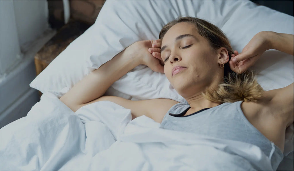 Woman waking comfortably in bed