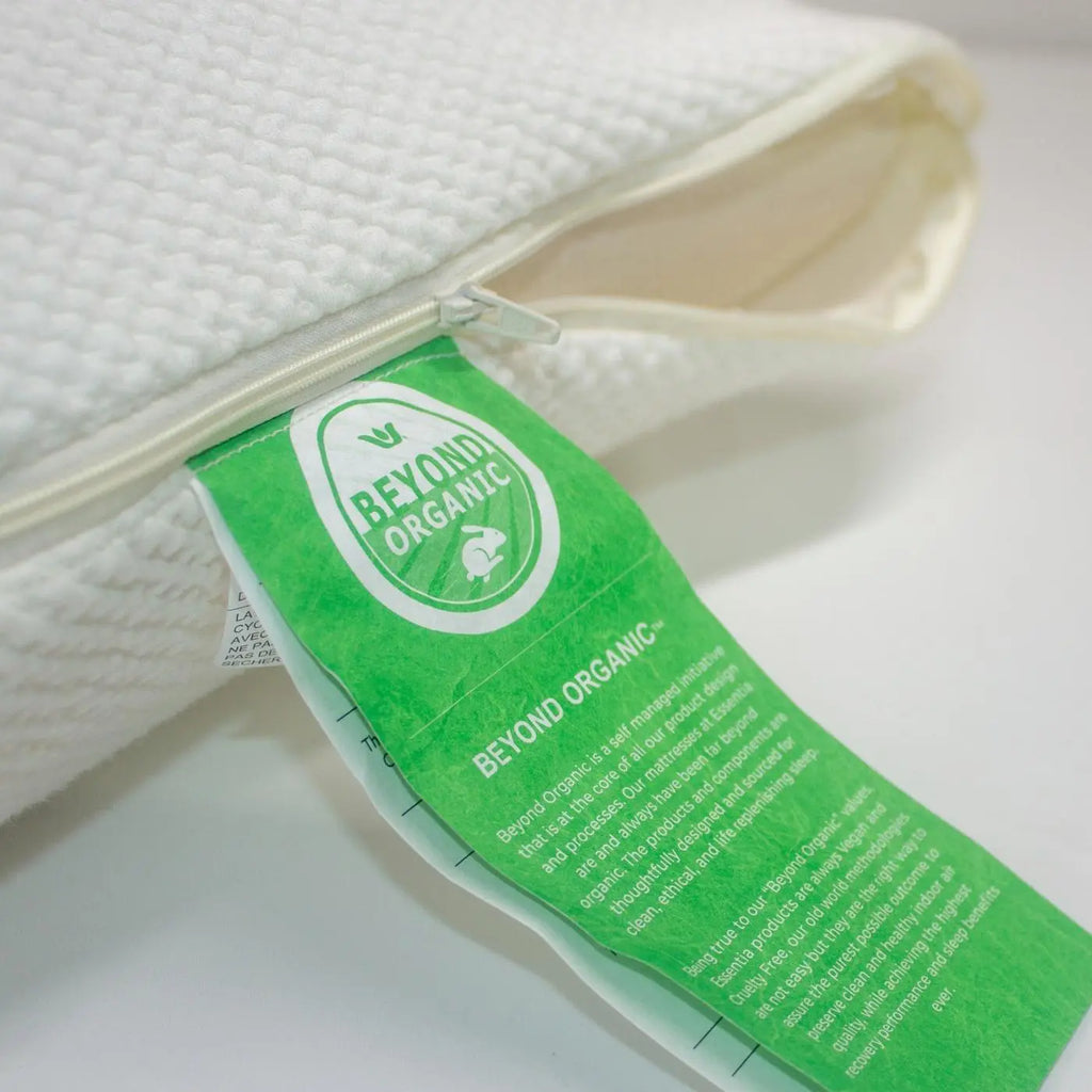 natural color cover of an Essentia organic pillow with the Beyond Organic tag and zipper shown open